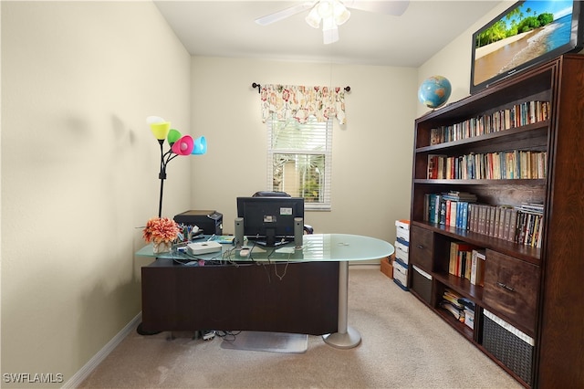 carpeted home office with ceiling fan