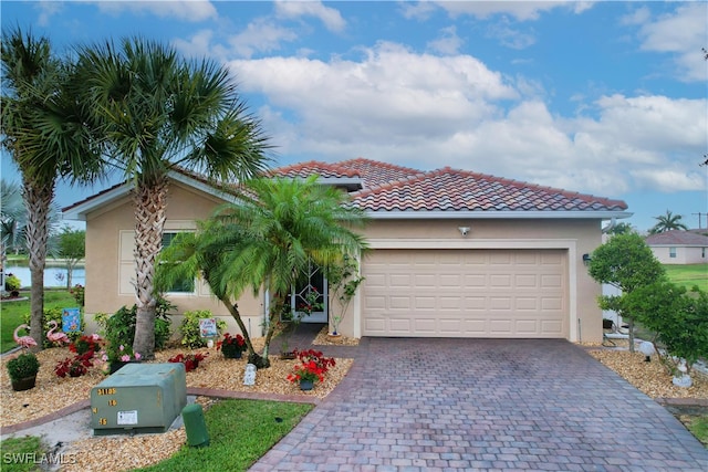 mediterranean / spanish-style house featuring a garage