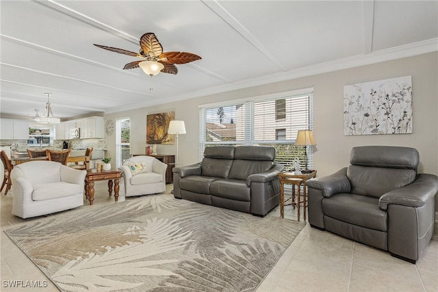 tiled living room featuring ceiling fan and crown molding