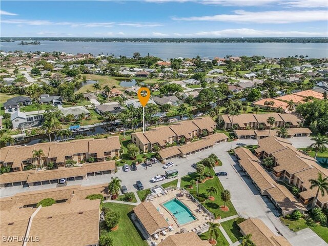 bird's eye view with a residential view and a water view