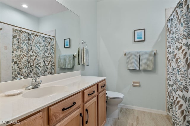 bathroom with tile patterned flooring, a shower with shower curtain, vanity, and toilet