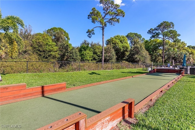 view of property's community with a lawn