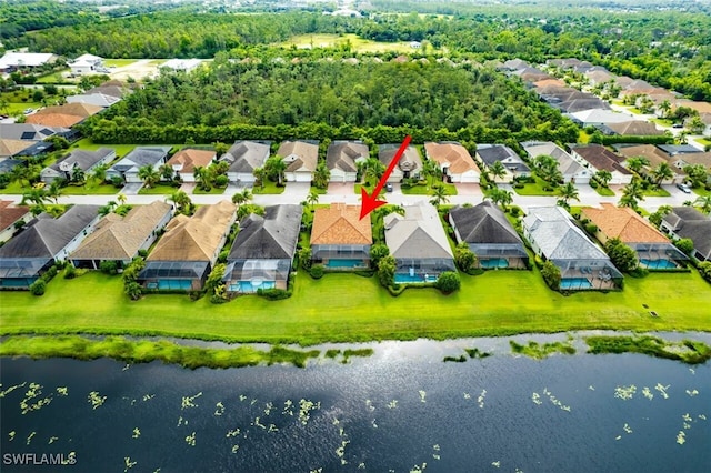 birds eye view of property featuring a water view