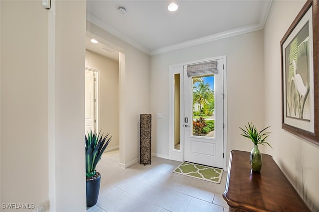 doorway to outside with light tile patterned floors and crown molding