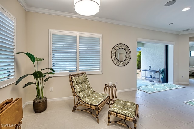 living area featuring ornamental molding and light tile patterned floors