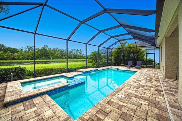 view of swimming pool with a lanai, a patio, and an in ground hot tub