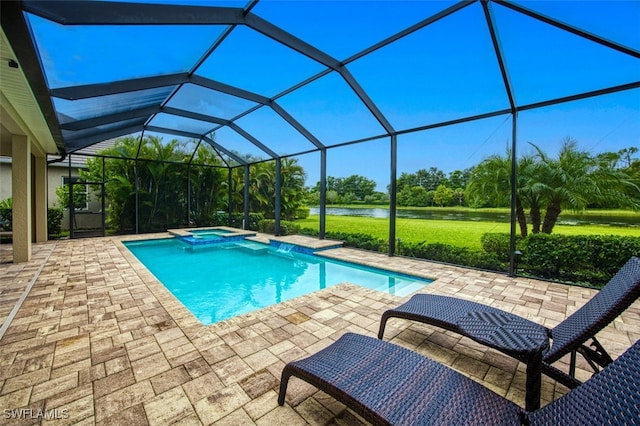 view of swimming pool with a lanai, an in ground hot tub, and a patio