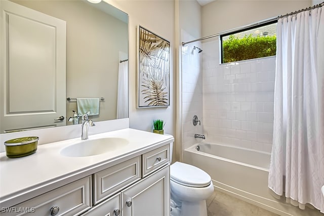 full bathroom with tile patterned floors, vanity, toilet, and shower / bath combo with shower curtain