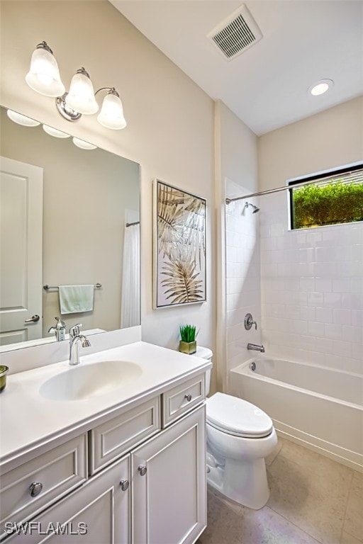 full bathroom with tile patterned flooring, vanity, shower / bathtub combination, and toilet