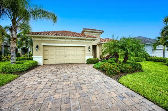 view of front facade featuring a front lawn and a garage