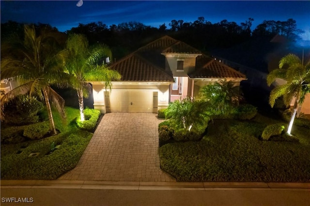 mediterranean / spanish-style house featuring a garage