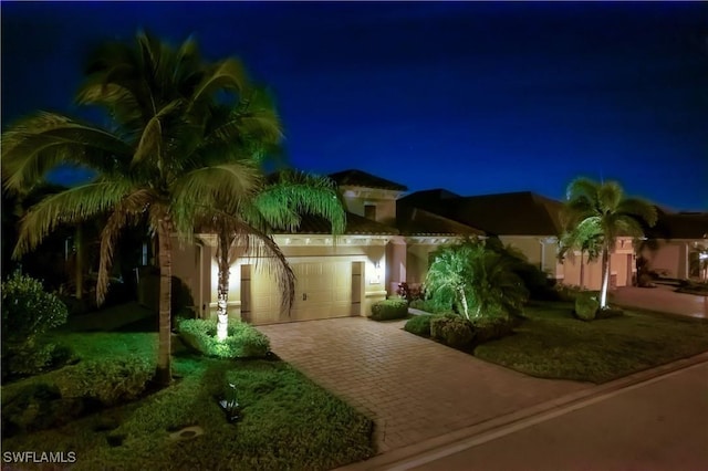 mediterranean / spanish-style house featuring a garage