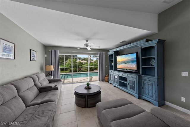 tiled living room with vaulted ceiling and ceiling fan