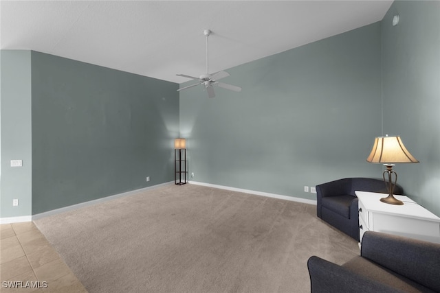 sitting room with light carpet, lofted ceiling, and ceiling fan