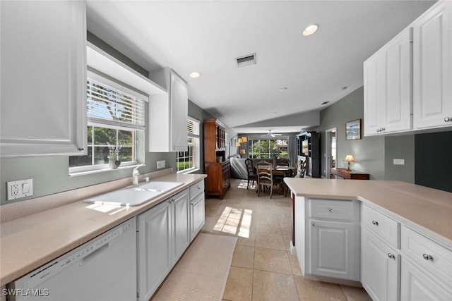 kitchen featuring white cabinets, sink, and white dishwasher