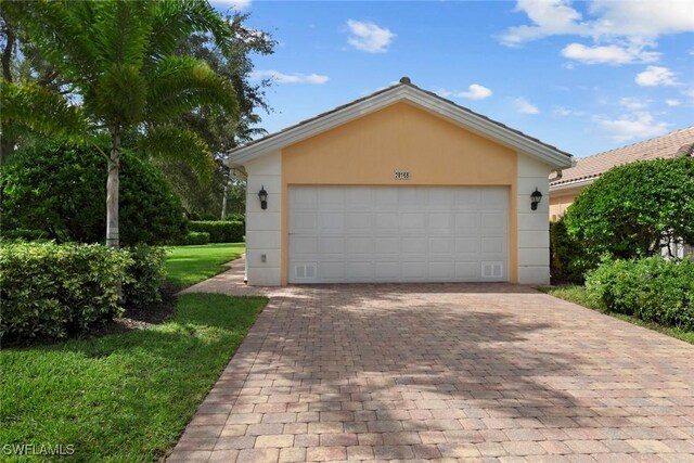 garage with a lawn