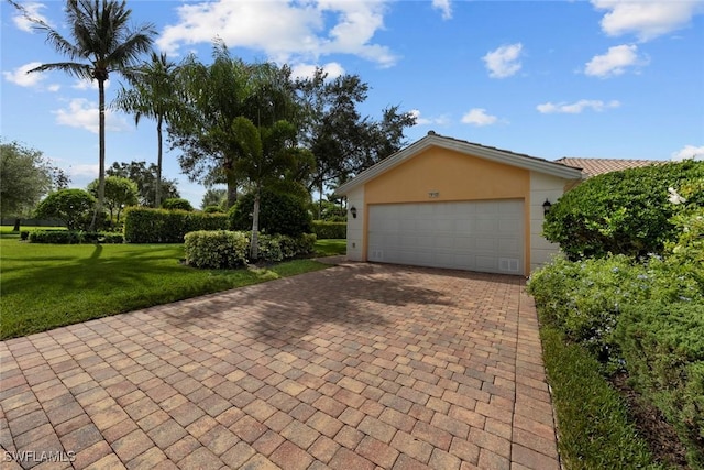 garage featuring a yard