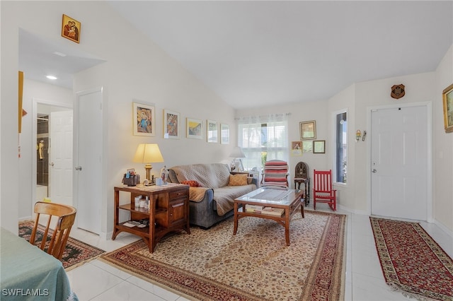 living room with light tile patterned flooring and high vaulted ceiling