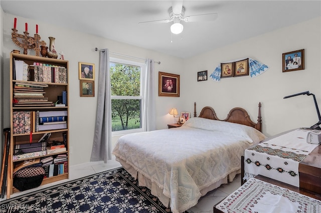 bedroom with tile patterned flooring and ceiling fan