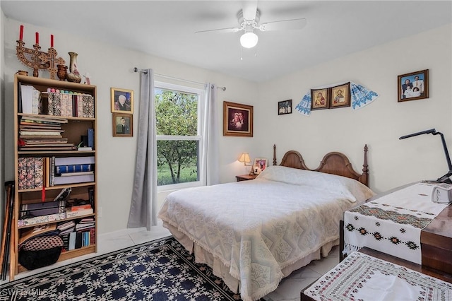 bedroom with tile patterned flooring and a ceiling fan