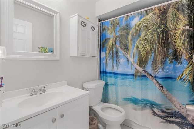 full bath with curtained shower, vanity, and toilet