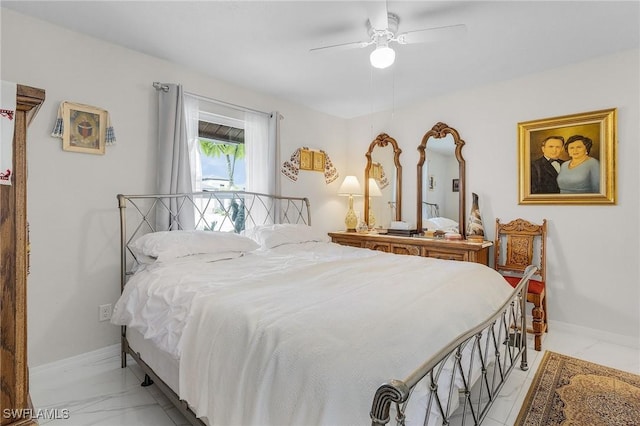 bedroom featuring marble finish floor, ceiling fan, and baseboards