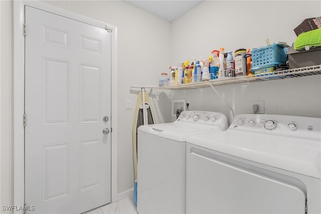 washroom with independent washer and dryer