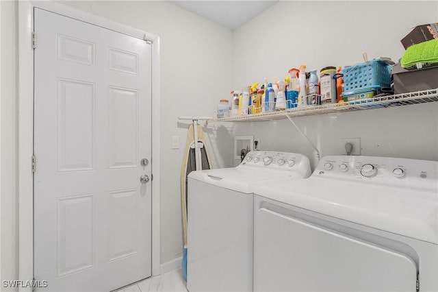 washroom featuring laundry area and washing machine and clothes dryer