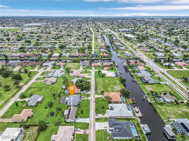 aerial view featuring a residential view and a water view