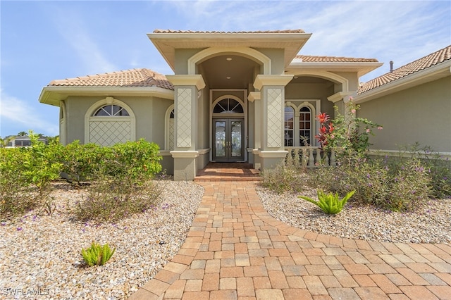 entrance to property featuring french doors