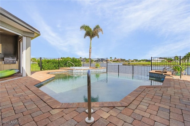 view of swimming pool with a patio area, a fenced backyard, a pool with connected hot tub, and a grill