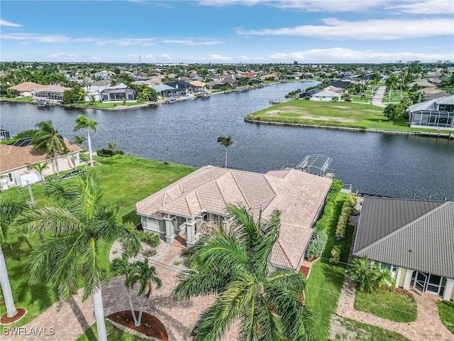 drone / aerial view with a residential view and a water view