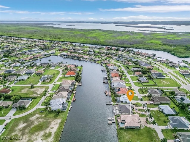 bird's eye view featuring a water view and a residential view