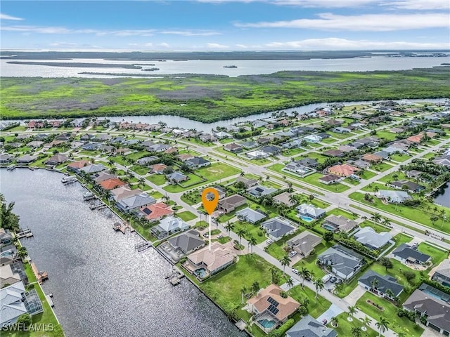 aerial view with a water view and a residential view