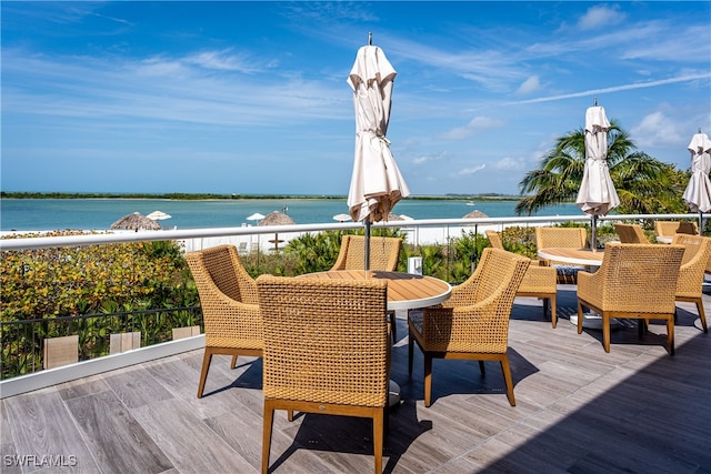 wooden deck with a water view