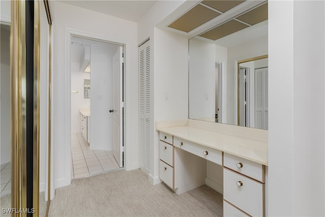 bathroom with tile patterned floors and vanity