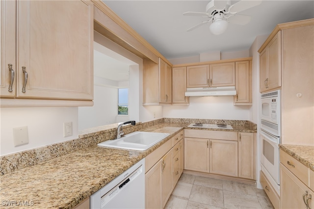 kitchen featuring sink, light brown cabinets, light tile patterned floors, white appliances, and ceiling fan