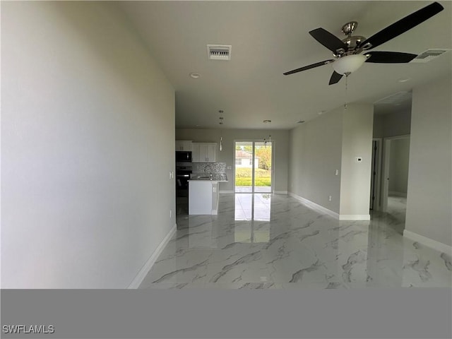 unfurnished room featuring ceiling fan