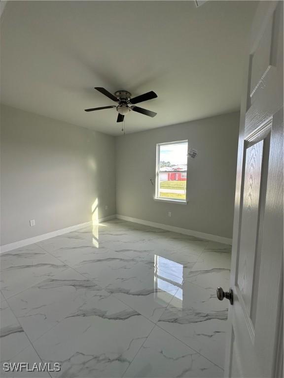 spare room featuring ceiling fan