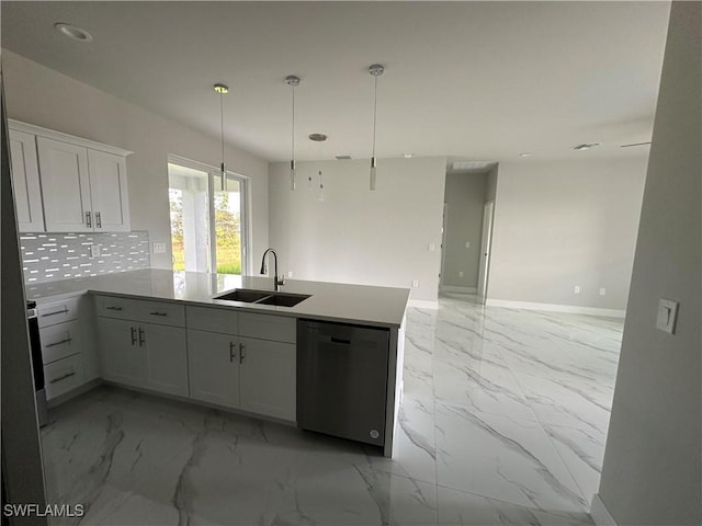 kitchen with sink, dishwasher, kitchen peninsula, and white cabinets