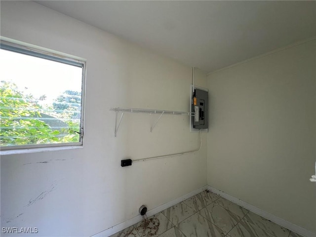 clothes washing area featuring electric panel