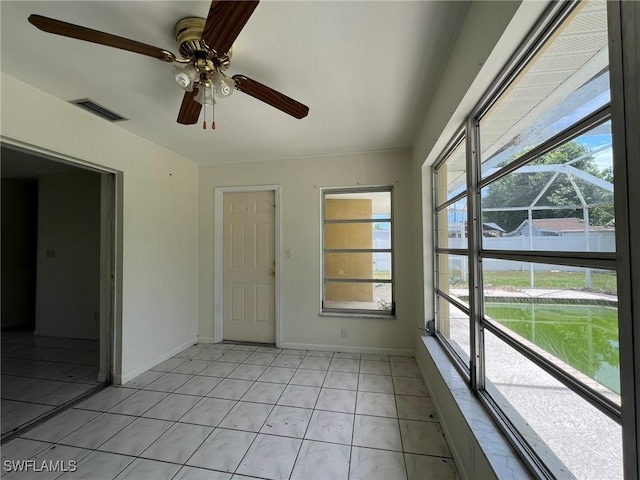 spare room with plenty of natural light and light tile patterned flooring