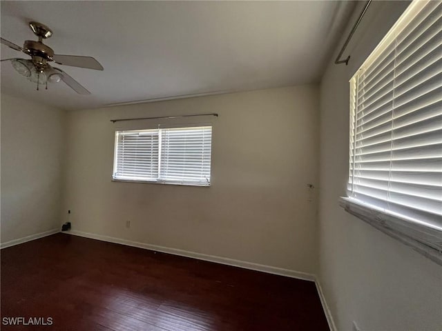 spare room with ceiling fan and wood-type flooring