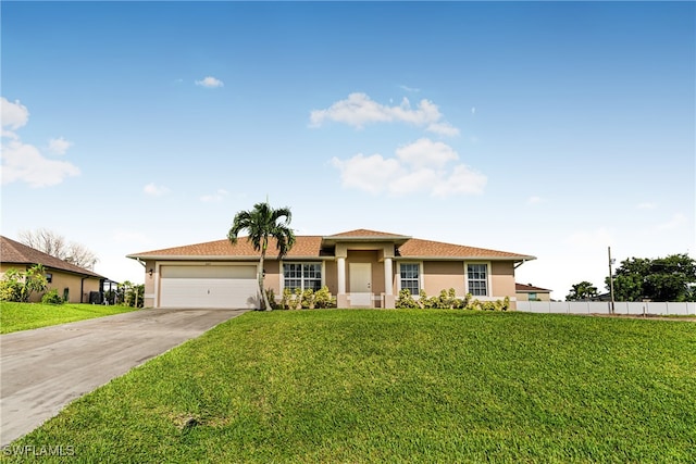 view of front of house with a garage and a front lawn