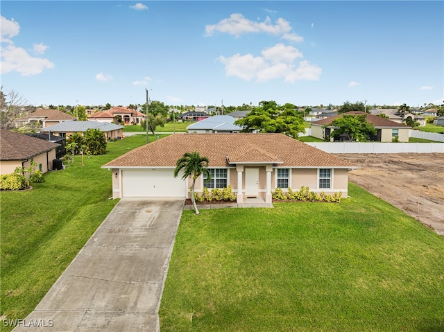 single story home featuring a front lawn