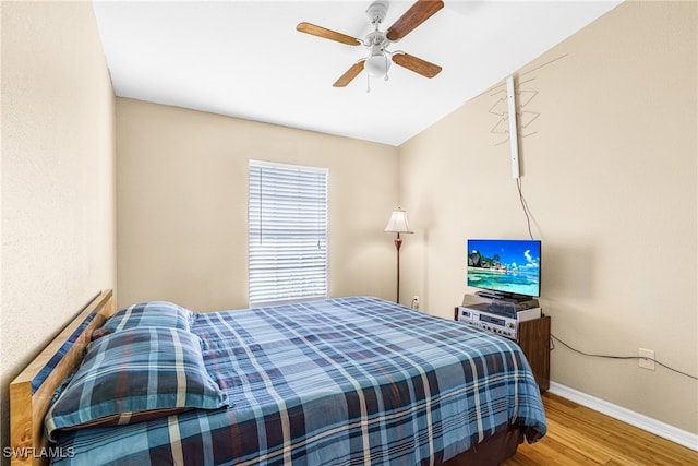 bedroom featuring ceiling fan and hardwood / wood-style flooring