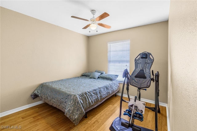 bedroom featuring light wood-type flooring and ceiling fan