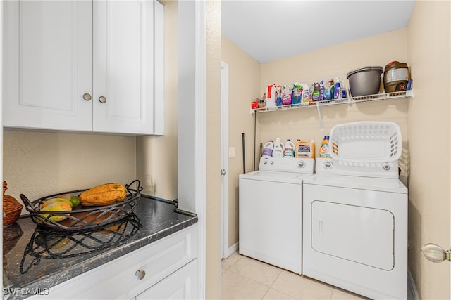 washroom featuring light tile patterned floors and washer and dryer