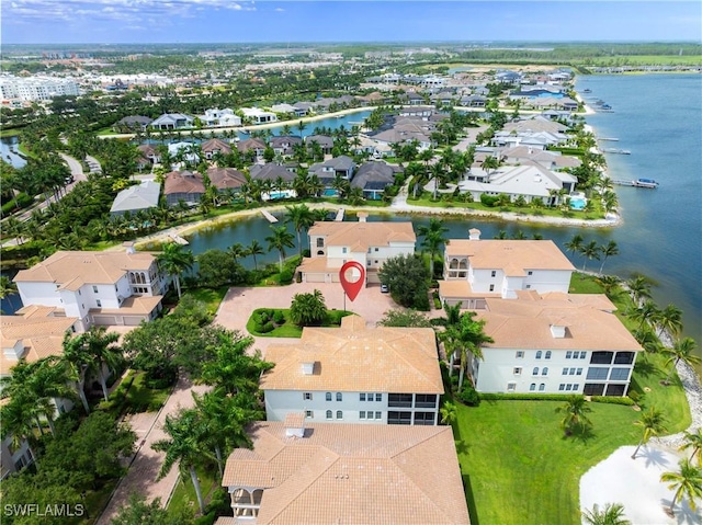 birds eye view of property featuring a residential view and a water view