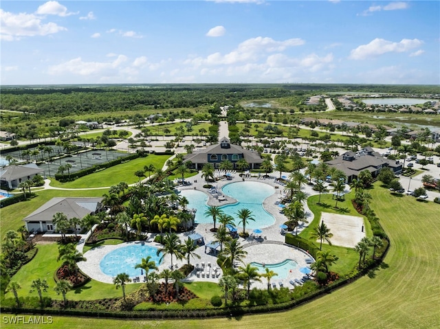 birds eye view of property with a water view